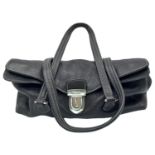 A Prada Black Vitello Shoulder Bag. Leather exterior with silver-toned hardware, two straps, push