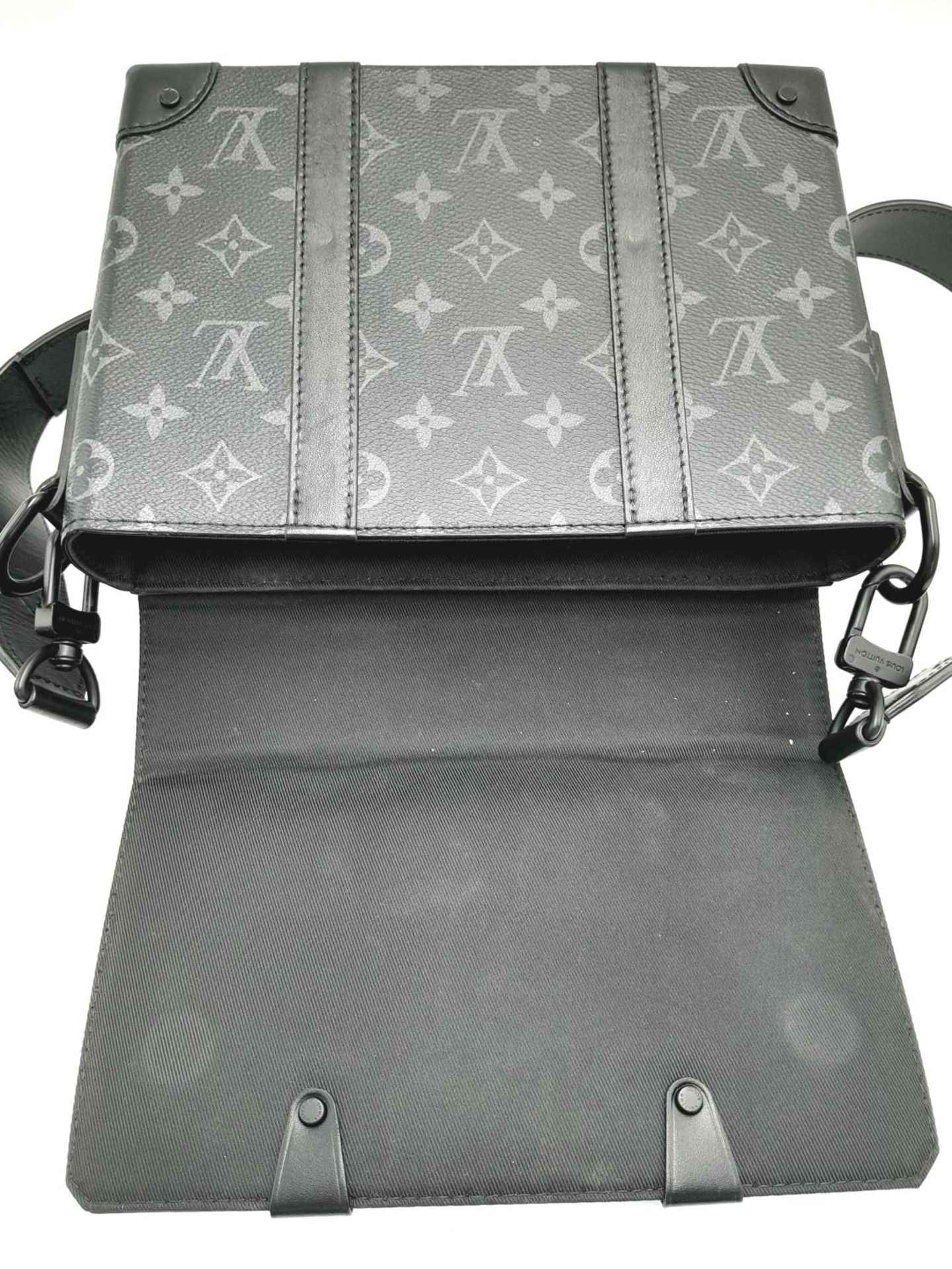 A Louis Vuitton Black Eclipse Trunk Messenger Bag. Monogramed canvas exterior with black-toned - Image 2 of 10