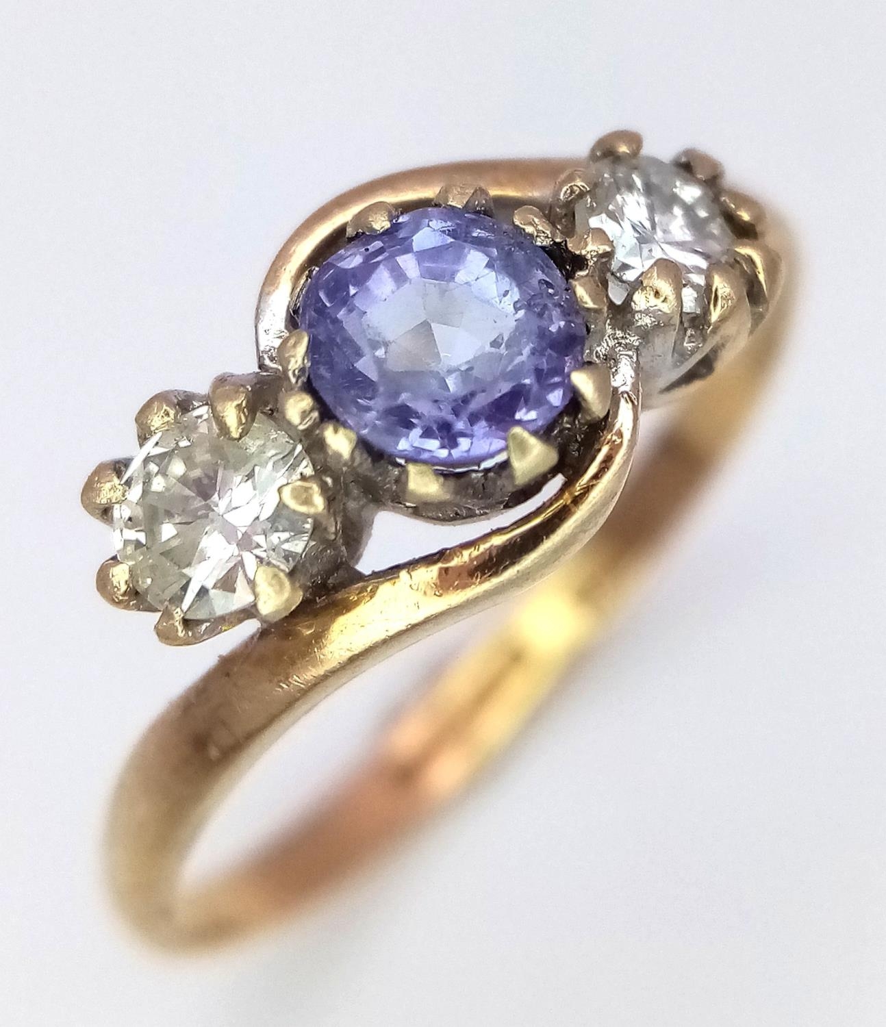 A 9K Yellow Gold Sapphire and Diamond Ring. Size K, 1.6g total weight.