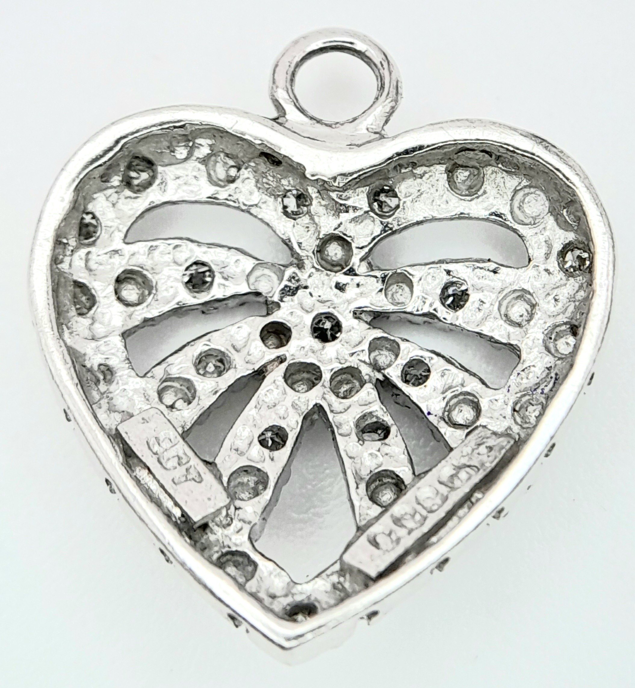 A 9K WHITE GOLD DIAMOND SET HEART PENDANT/CHARM. 1.6cm length, 1.4g total weight. Ref: SC 8020 - Image 2 of 4