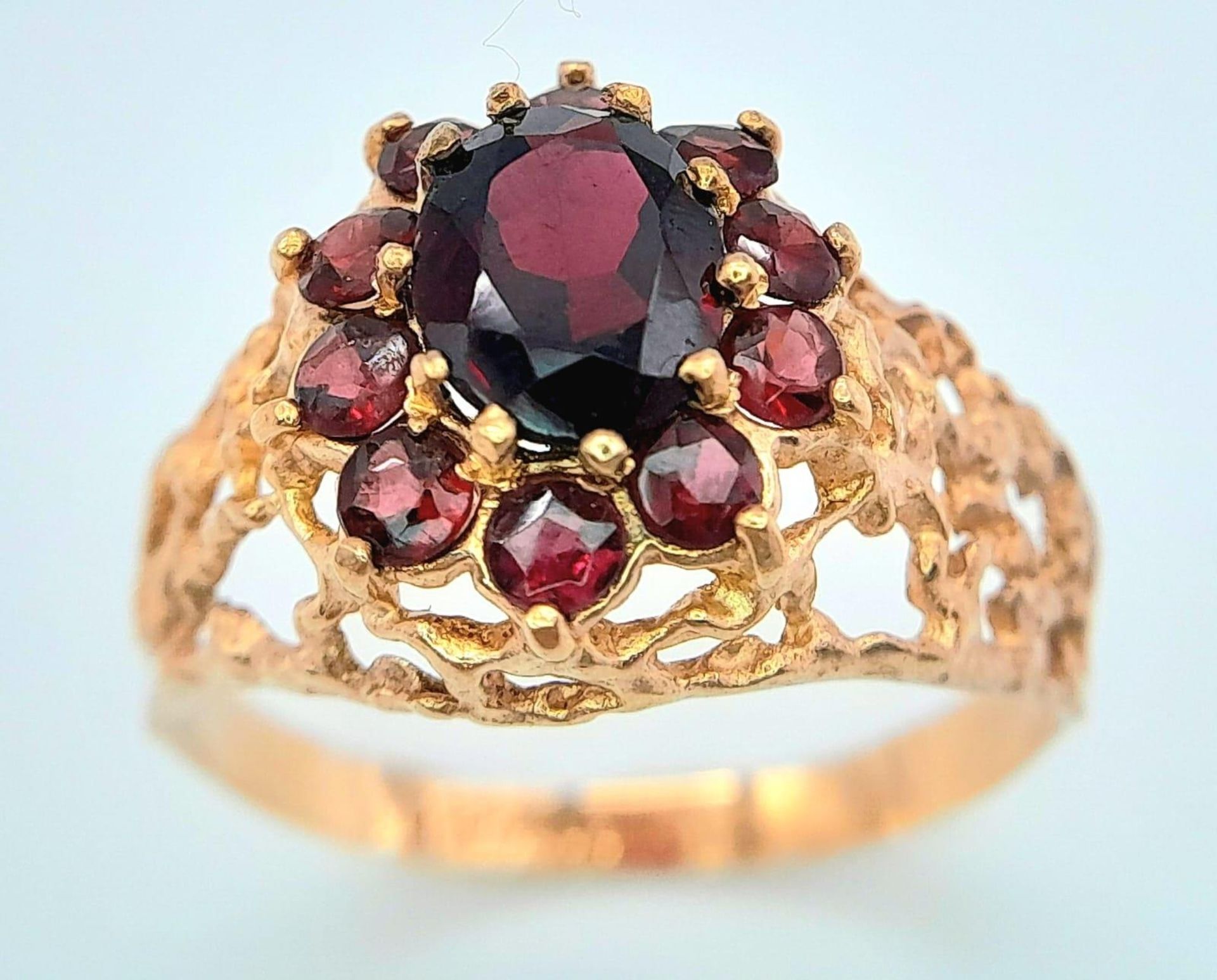 A vintage oval cluster garnet 9ct gold ring surrounded by a halo of bright red garnets in a - Bild 4 aus 6