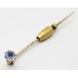 An Antique Ceylon Sapphire Stick Pin. 5.8cm length, 2.64g total weight.