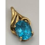 9 carat GOLD and TOPAZ PENDANT. Having a 1.5 carat OCEAN BLUE TOPAZ ,Oval Cut and set in a four claw