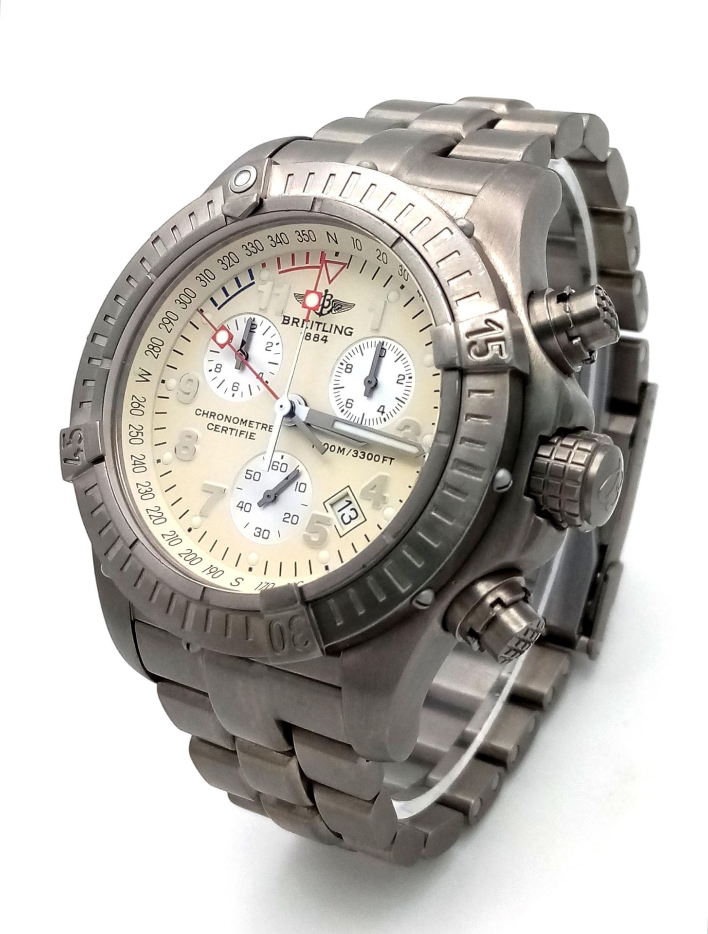 A Breitling Chrono Avenger M1 Quartz Gents Watch. Titanium bracelet and case - 44mm. Cream dial with