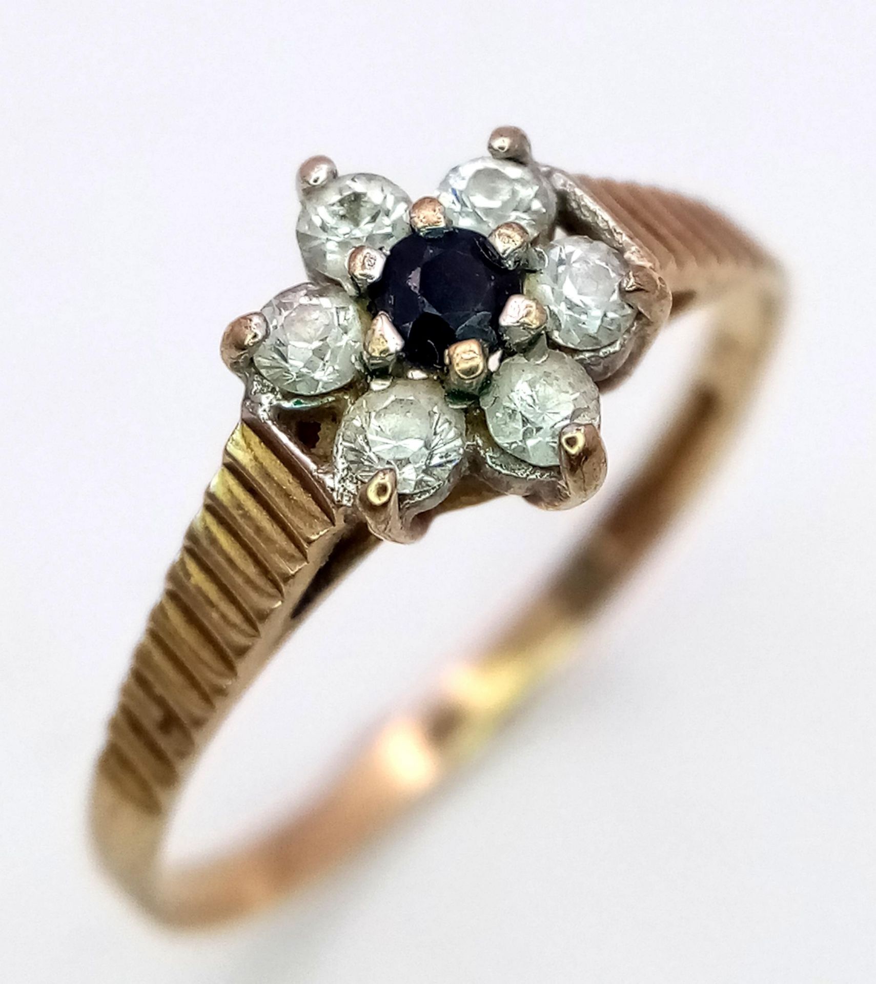 A Vintage 9K Yellow Gold Sapphire and White Zircon Ring. Size L. 1.2g total weight.