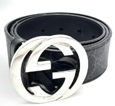 A Gucci Black with Grey Monogram Men's GG Belt. Silver-toned hardware. Approximately 104.5cm length,