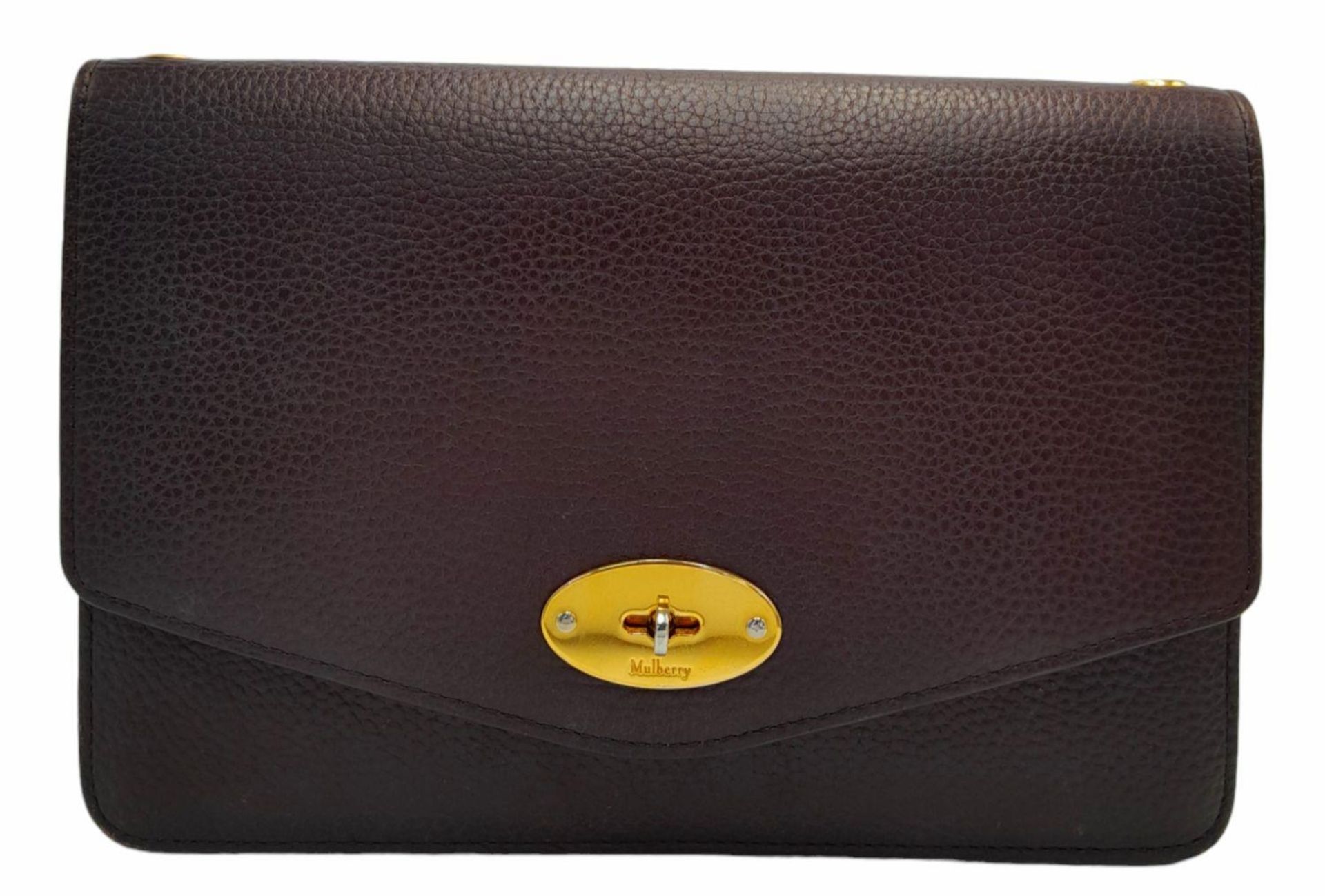 A Mulberry Oxblood Darley Bag. Leather exterior with gold-toned hardware and twist lock closure.