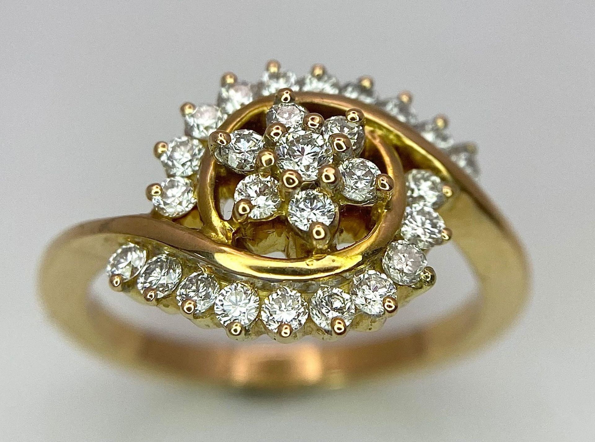An attractive 14K Yellow Gold (tested as) Diamond Swirl Ring, 0.55ct diamond weight, 4.6g total - Image 3 of 6