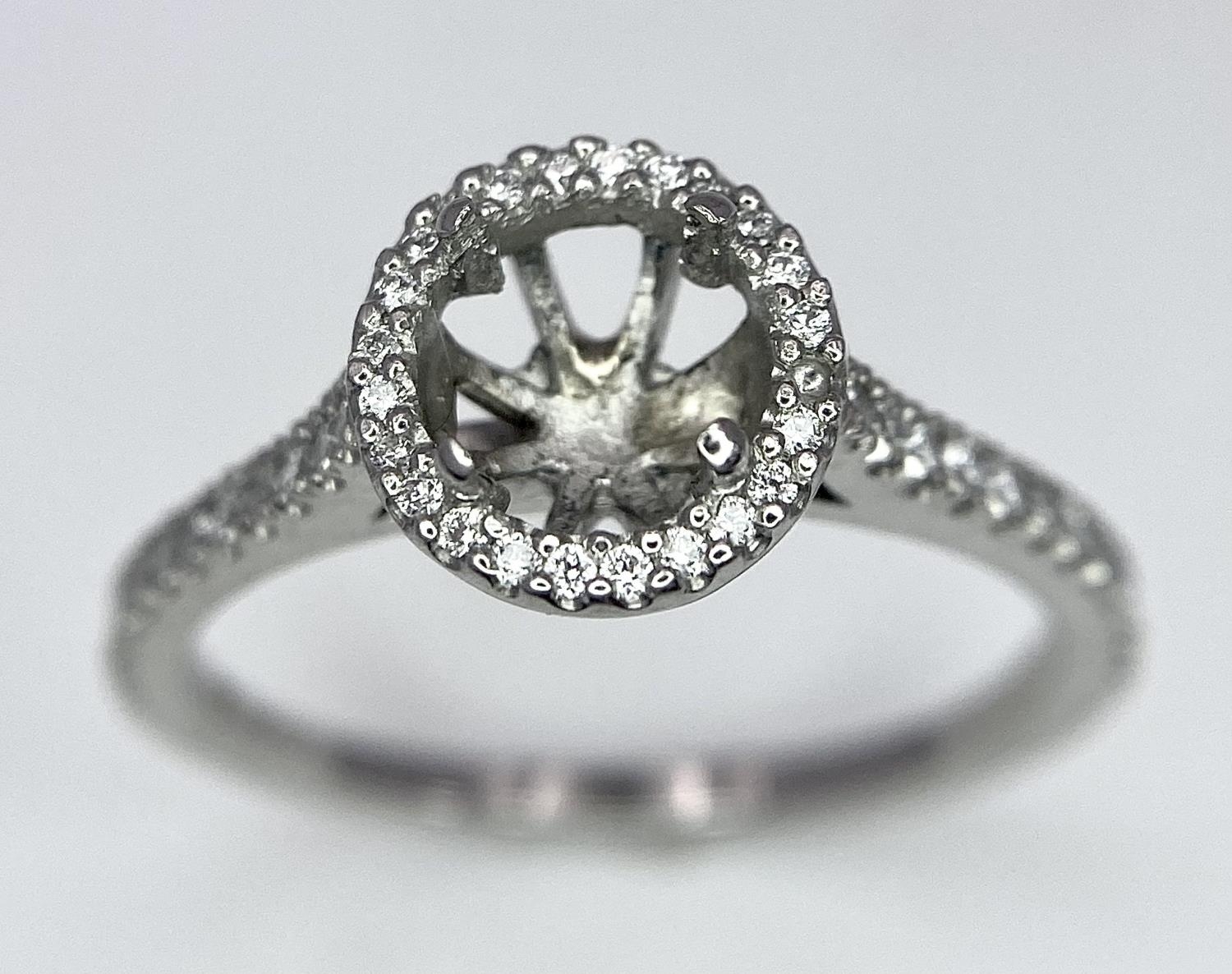 A PLATINUM DIAMOND SET HALO AND SHOULDERS RING MOUNT 0.40CT, READY TO SET YOUR DREAM GEMSTONE 4.3G