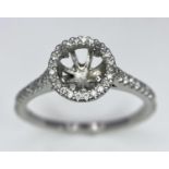 A PLATINUM DIAMOND SET HALO AND SHOULDERS RING MOUNT 0.40CT, READY TO SET YOUR DREAM GEMSTONE 4.3G