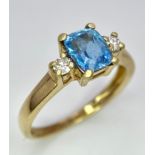 A 9K Yellow Gold Aquamarine and Diamond Ring. Size M, 2.14g total weight.