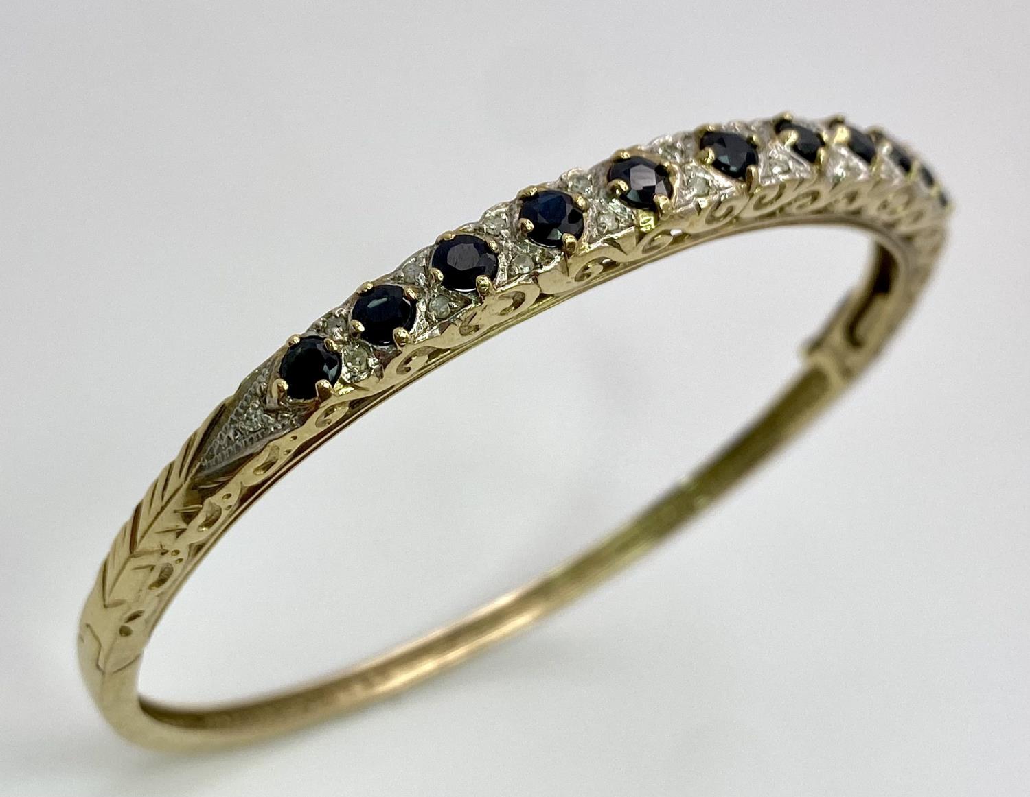 A 9K YELLOW GOLD DIAMOND & SAPPHIRE SET BANGLE 10.4G , 55mm x 63mm diameter. SC 9005 - Image 2 of 8