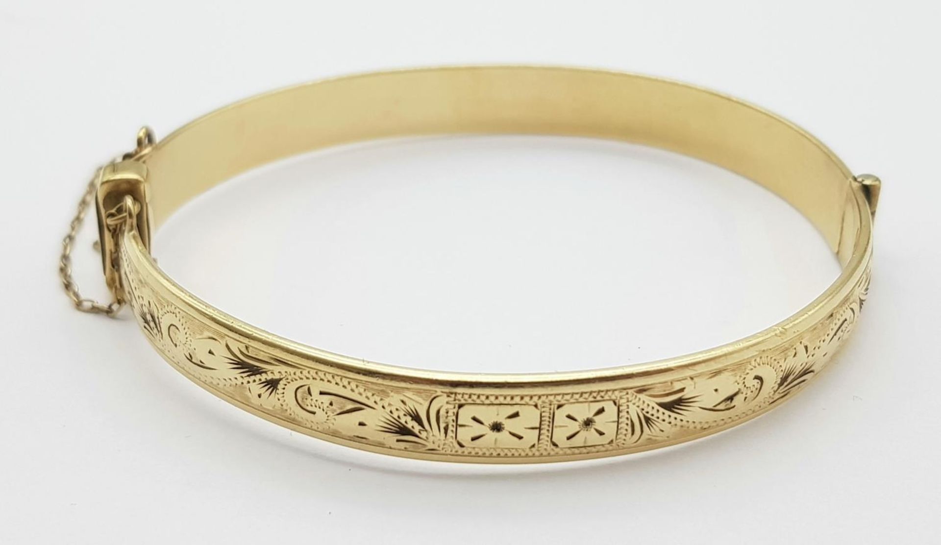 A 9K YELLOW GOLD AND METAL CORE ENGARVED BANGLE 18.3G , 53mm x 60mm diameter. ref: ADAM 9001 - Image 2 of 5