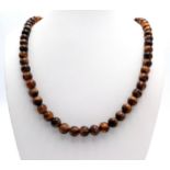A Tigers Eye Beaded Necklace with Silver Clasp. 8mm beads. 46cm.