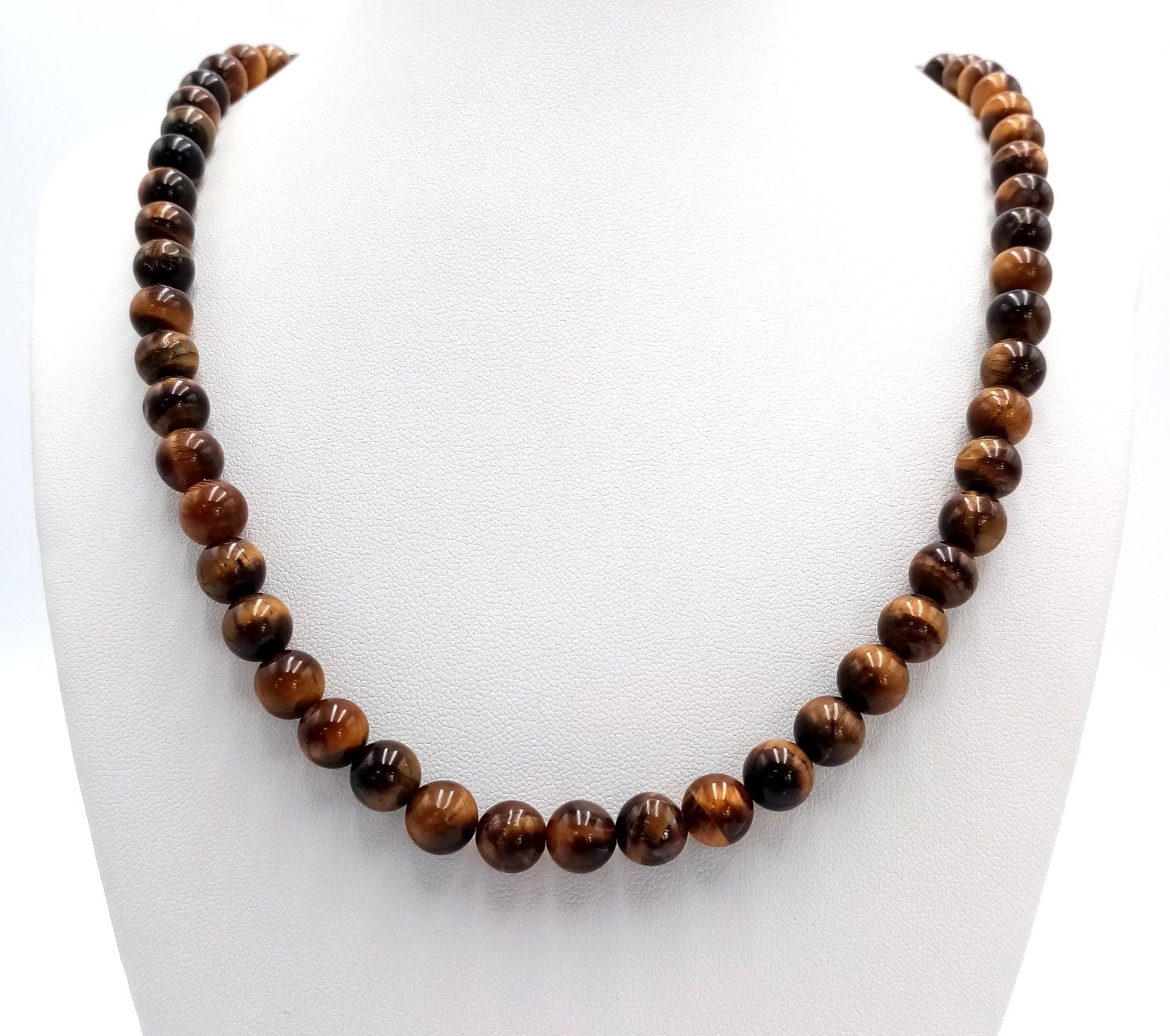 A Tigers Eye Beaded Necklace with Silver Clasp. 8mm beads. 46cm.