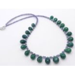 A 125ctw Tanzanite Gemstone Single Strand Necklace with Emerald Drops. 925 Silver Clasp. 42cm.