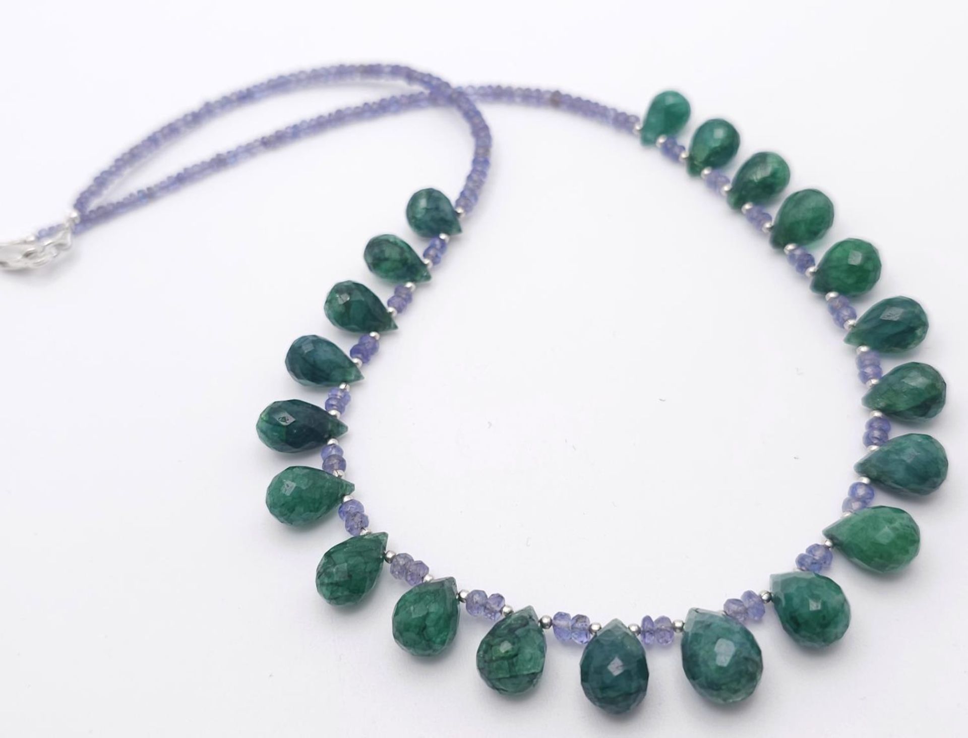 A 125ctw Tanzanite Gemstone Single Strand Necklace with Emerald Drops. 925 Silver Clasp. 42cm.