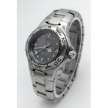 A Tag Heuer Professional Ladies Quartz Watch. Stainless steel bracelet and case - 28mm. Grey dial