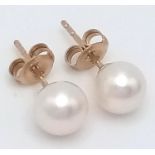 A Pair of 9K Yellow Gold Cultured Pearl Stud Earrings. In box.