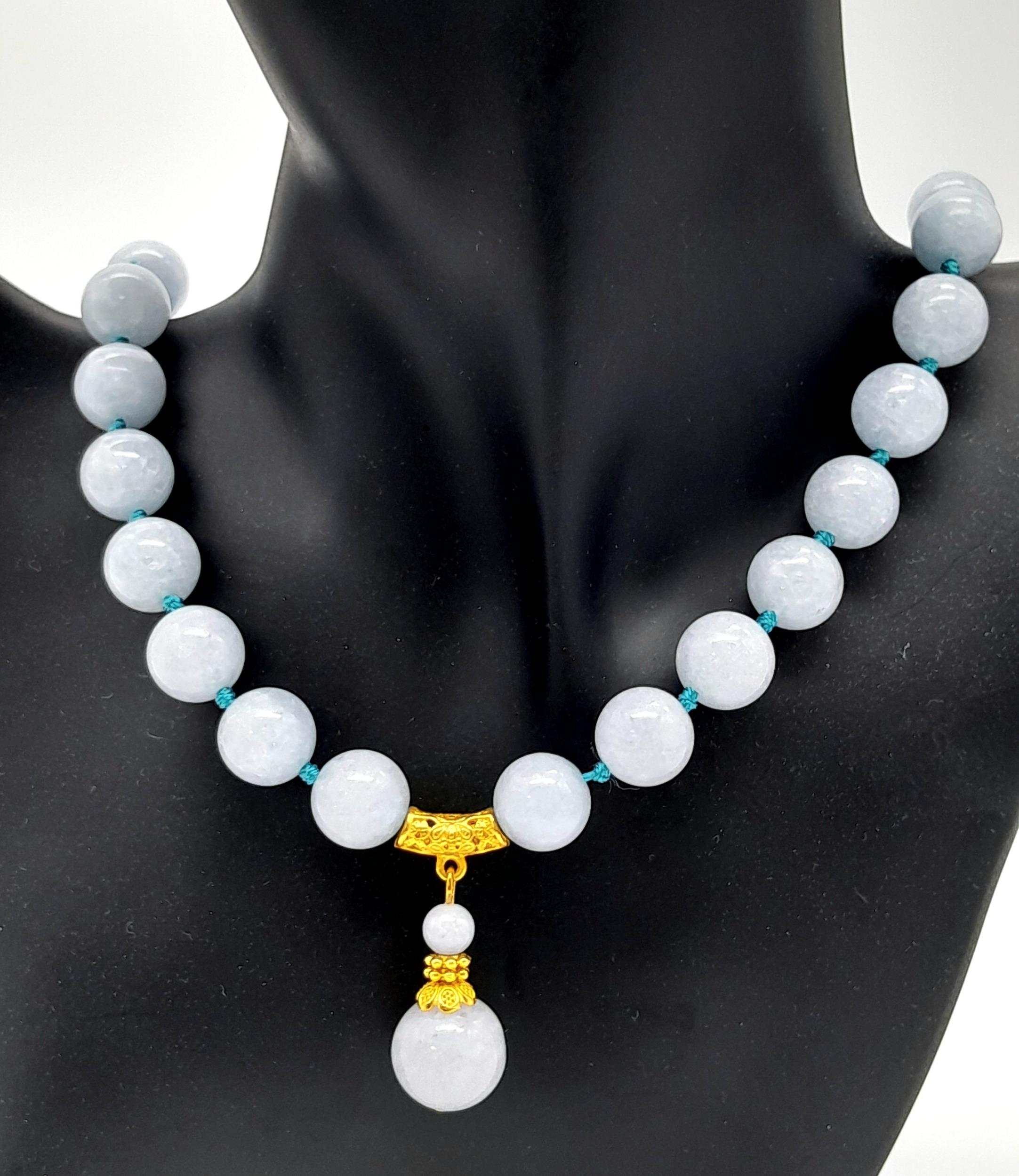An Aquamarine Beaded Necklace with Drop Pendant. 12mm beads. 4cm pendant. 44cm necklace.