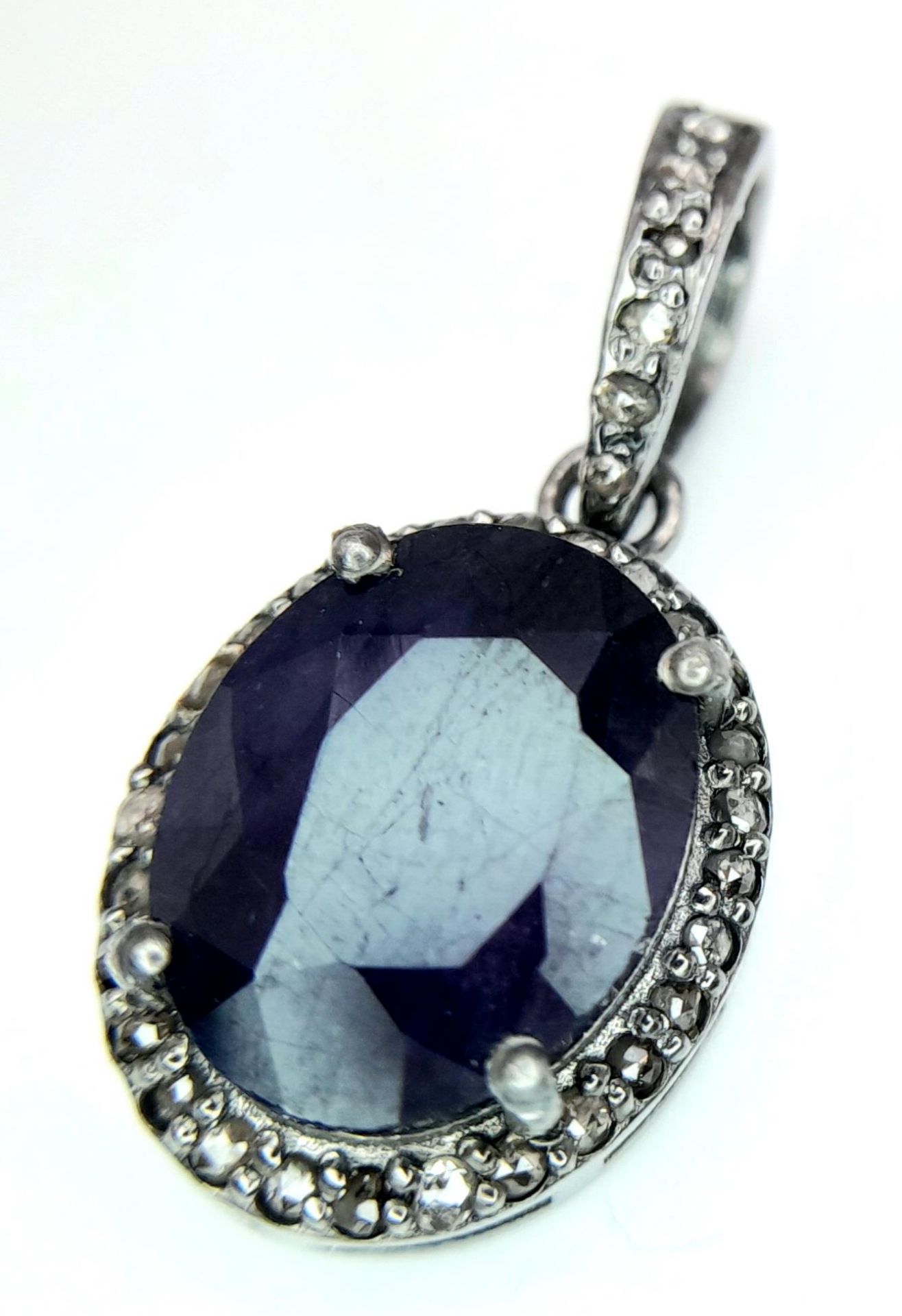 A Blue Sapphire and Rose cut Diamond Pendant. Set in 925 Sterling Silver. Sapphire - 4.30ct.
