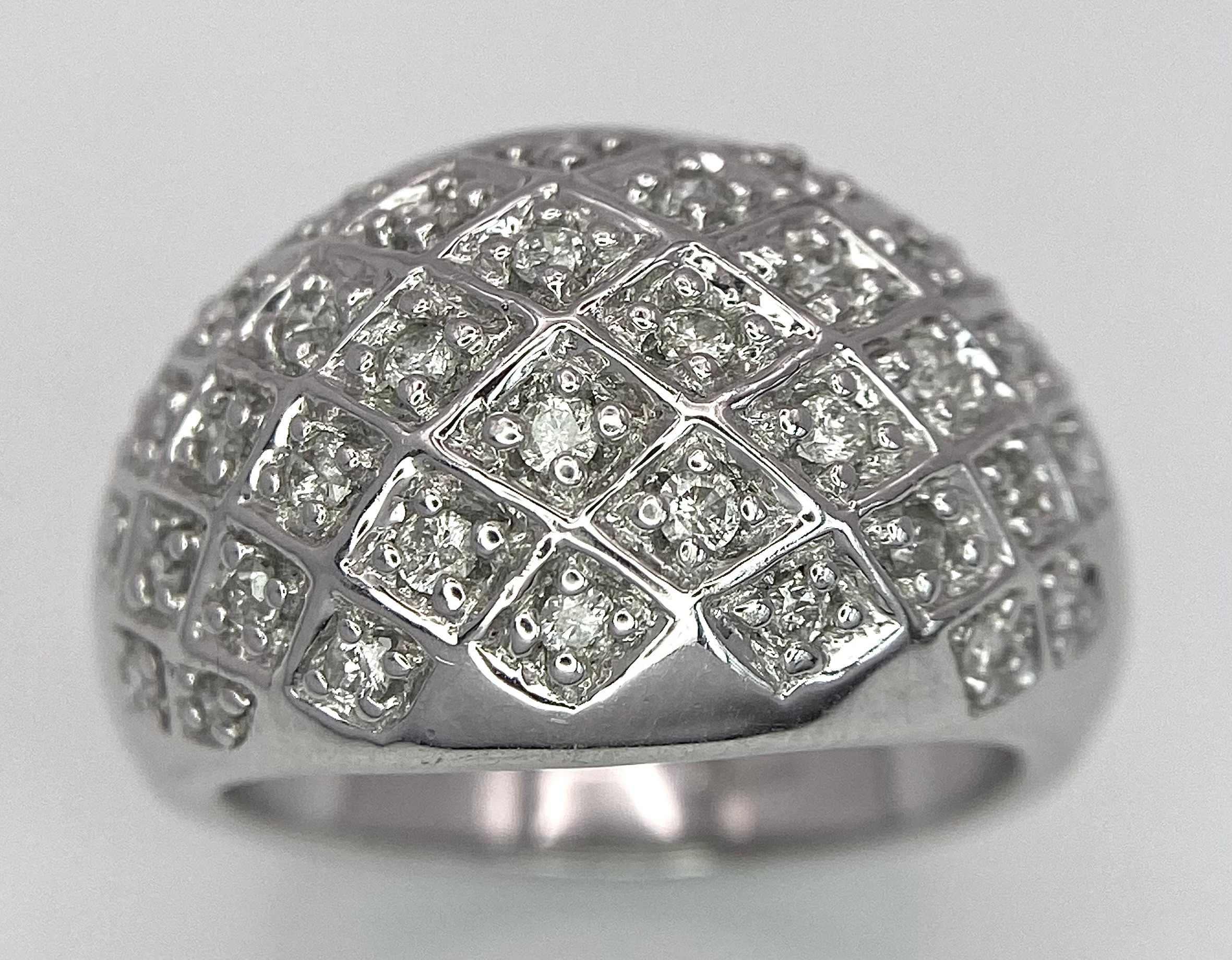 A 9K WHITE GOLD DIAMOND SET BOMBE RING 0.25CT 10.2G SIZE O. SC 9010