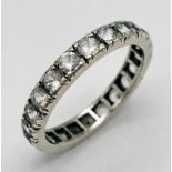 A VINTAGE 9K WHITE GOLD (TESTED) WHITE STONE FULL ETERNITY RING. 2.5G. SIZE 0.