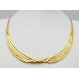 A Stylish Italian 18K Yellow Gold Choker Necklace. A single to a four row centre with buckle