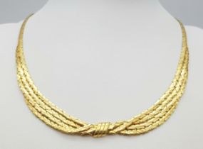 A Stylish Italian 18K Yellow Gold Choker Necklace. A single to a four row centre with buckle