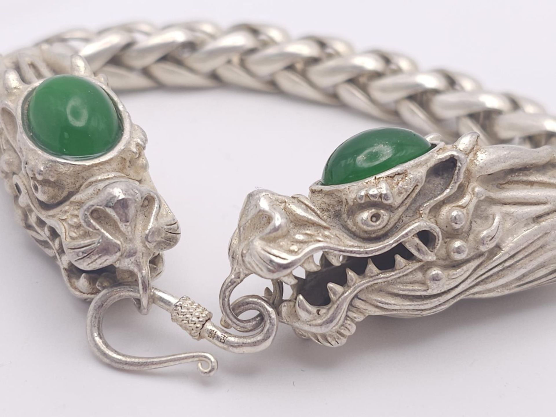 A Tibetan Silver Twin Dragon Head Bracelet. Jade cabochon decoration. 20cm. - Image 3 of 7