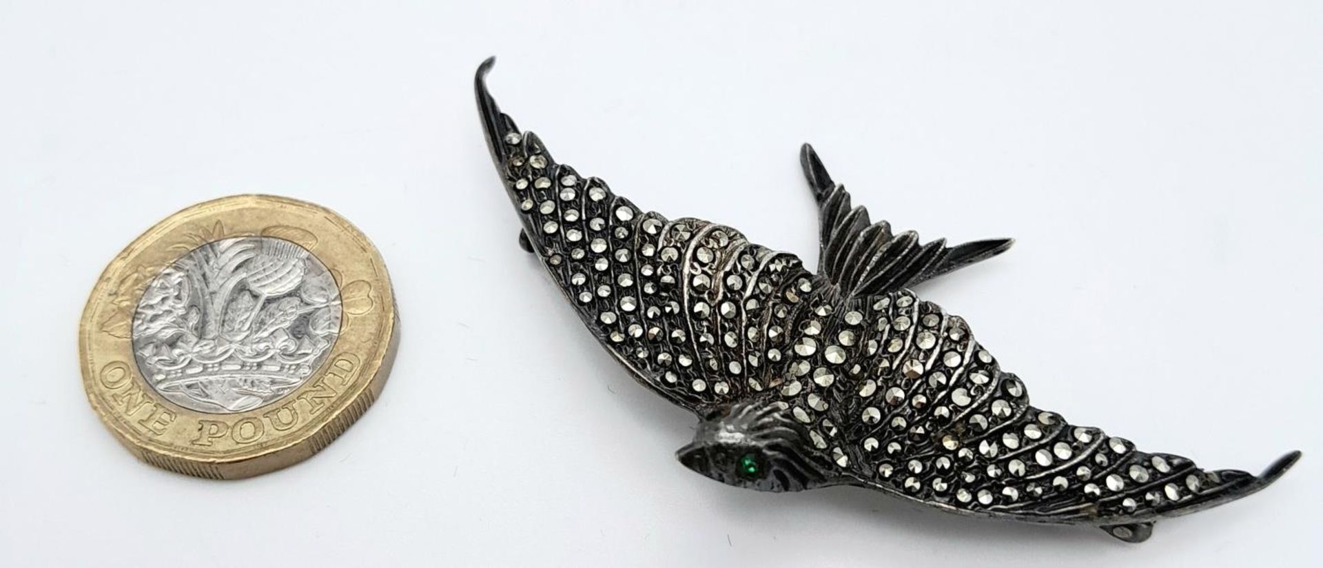 A Vintage Silver and Marcasite Brooch of a Bird in Flight. 7cm wingspan. Green stone eyes. - Image 4 of 7