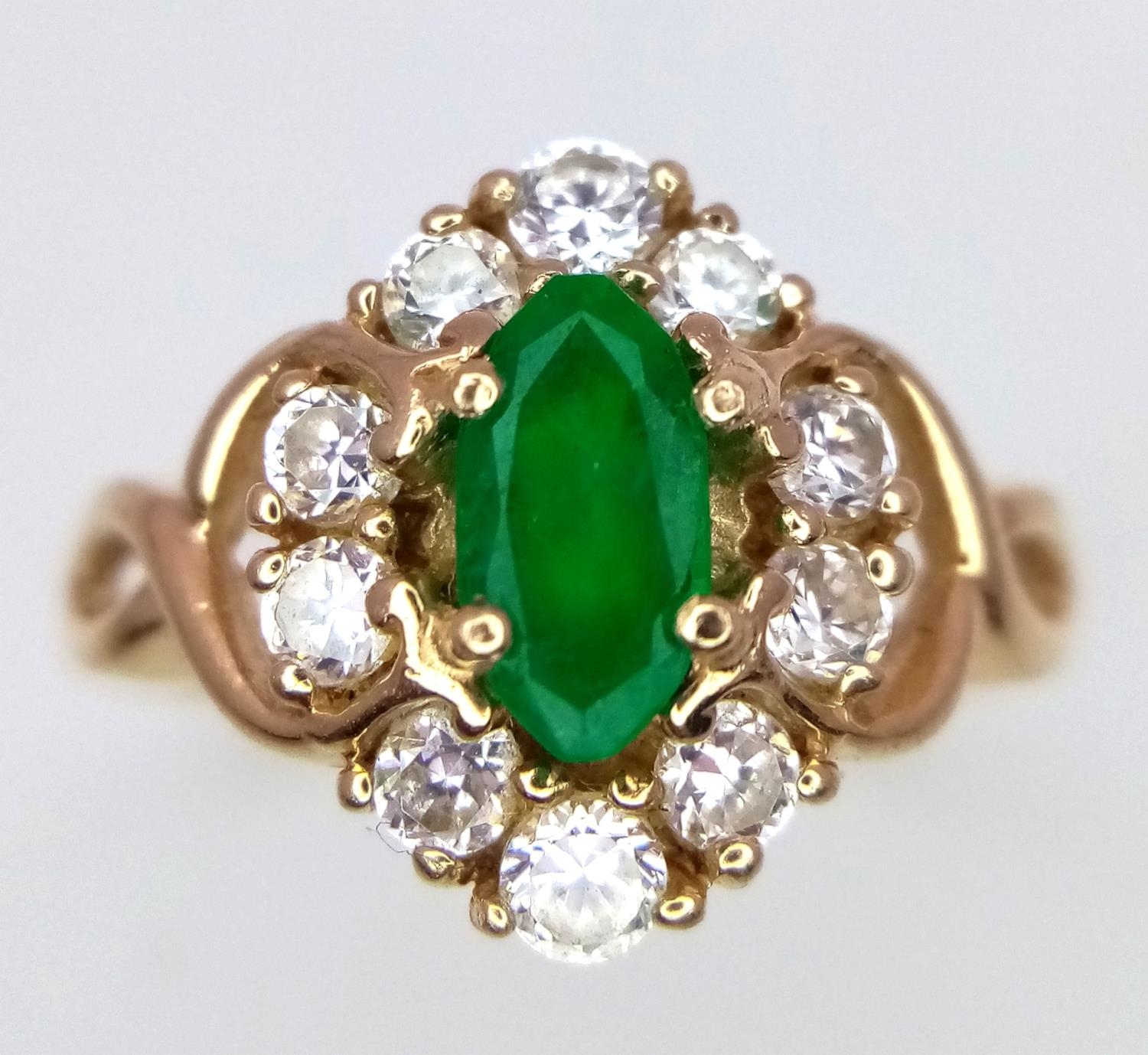 A 14K Yellow Gold Emerald and White Stone Ring. 1.2ct emerald. Size O, 3.34g total weight. - Image 2 of 5