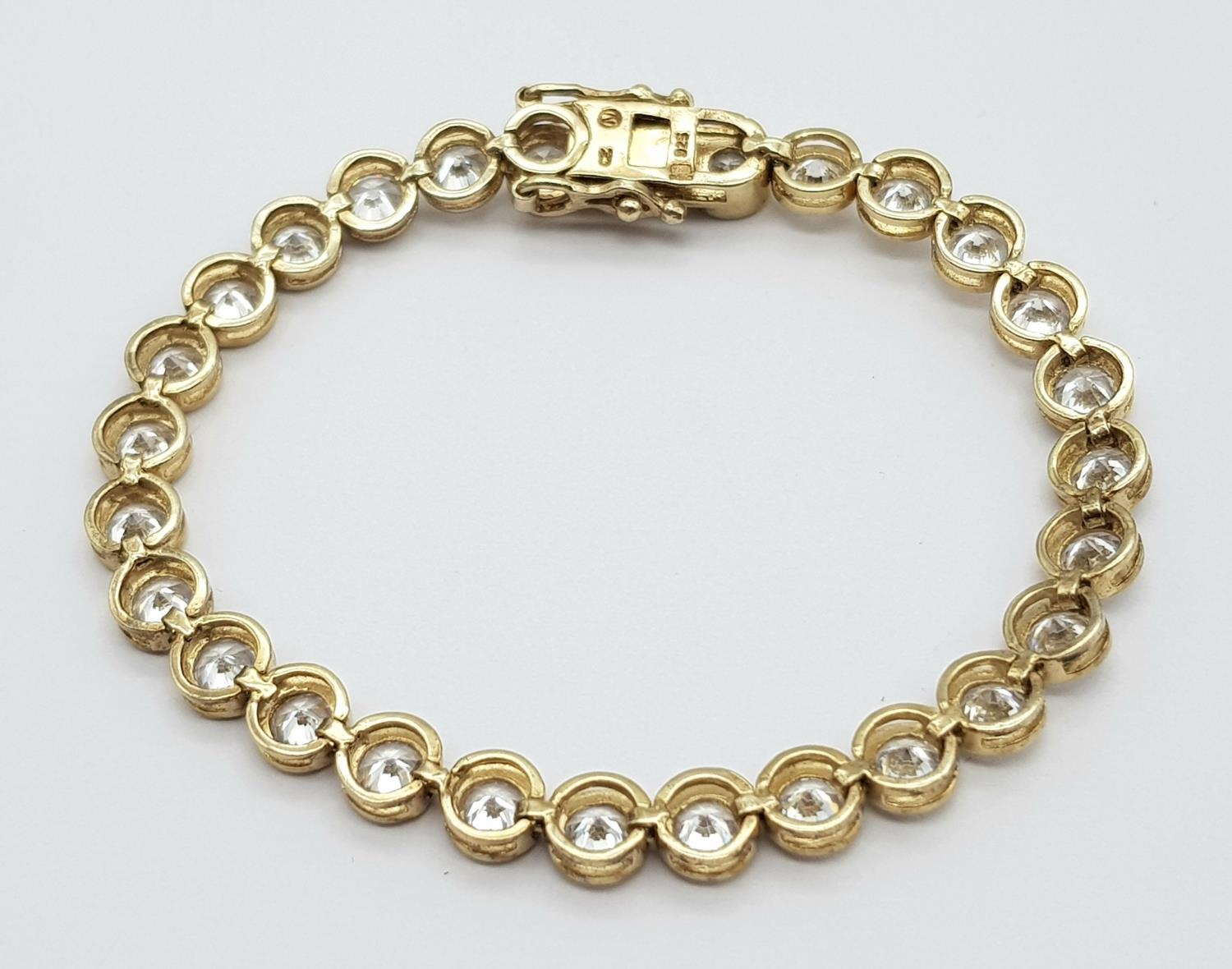 A Gilded 925 Silver Cubic Zirconia Bracelet. 18.5cm length, 16.4g total weight. - Image 4 of 5