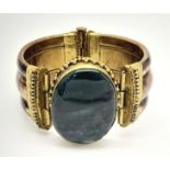 A Yellow Metal Middle Eastern/Asian Jasper Set Hinge Bracelet. 6.5cm Inner Diameter. 90.3 Grams