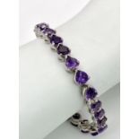 An Amethyst Gemstone Tennis Bracelet set in 925 Silver. Heart shaped amethysts. 18cm. 25g. Ref: CD-