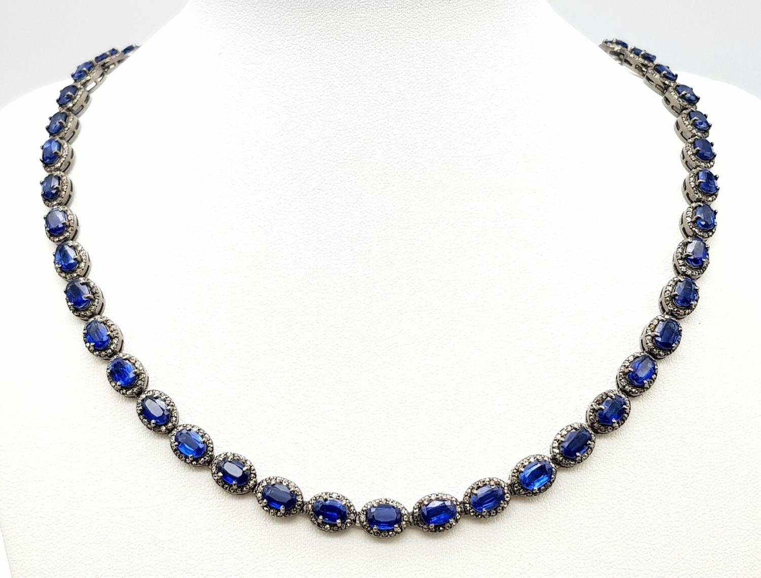 A 25ctw Kyanite Gemstone Tennis Necklace with Diamond Accents. 4ctw of old cut diamonds. Set in