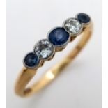 An 18K Gold (tested) Diamond and Pale Blue Sapphire Ring. Size O. 2.6g total weight.