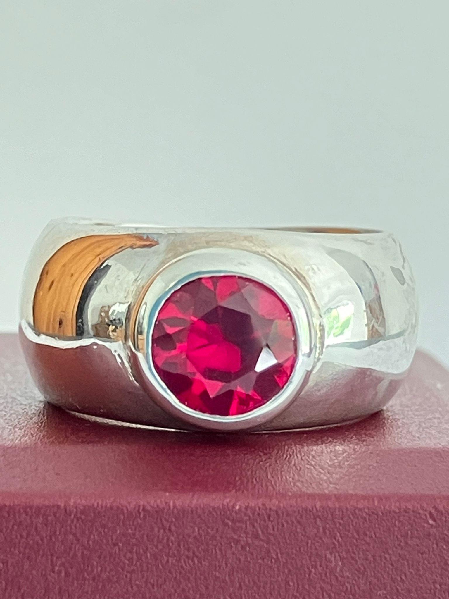 SILVER and RUBY RING, consisting a 1.5 carat Round Cut Ruby mounted to top of a Wide Silver Band. - Image 2 of 3