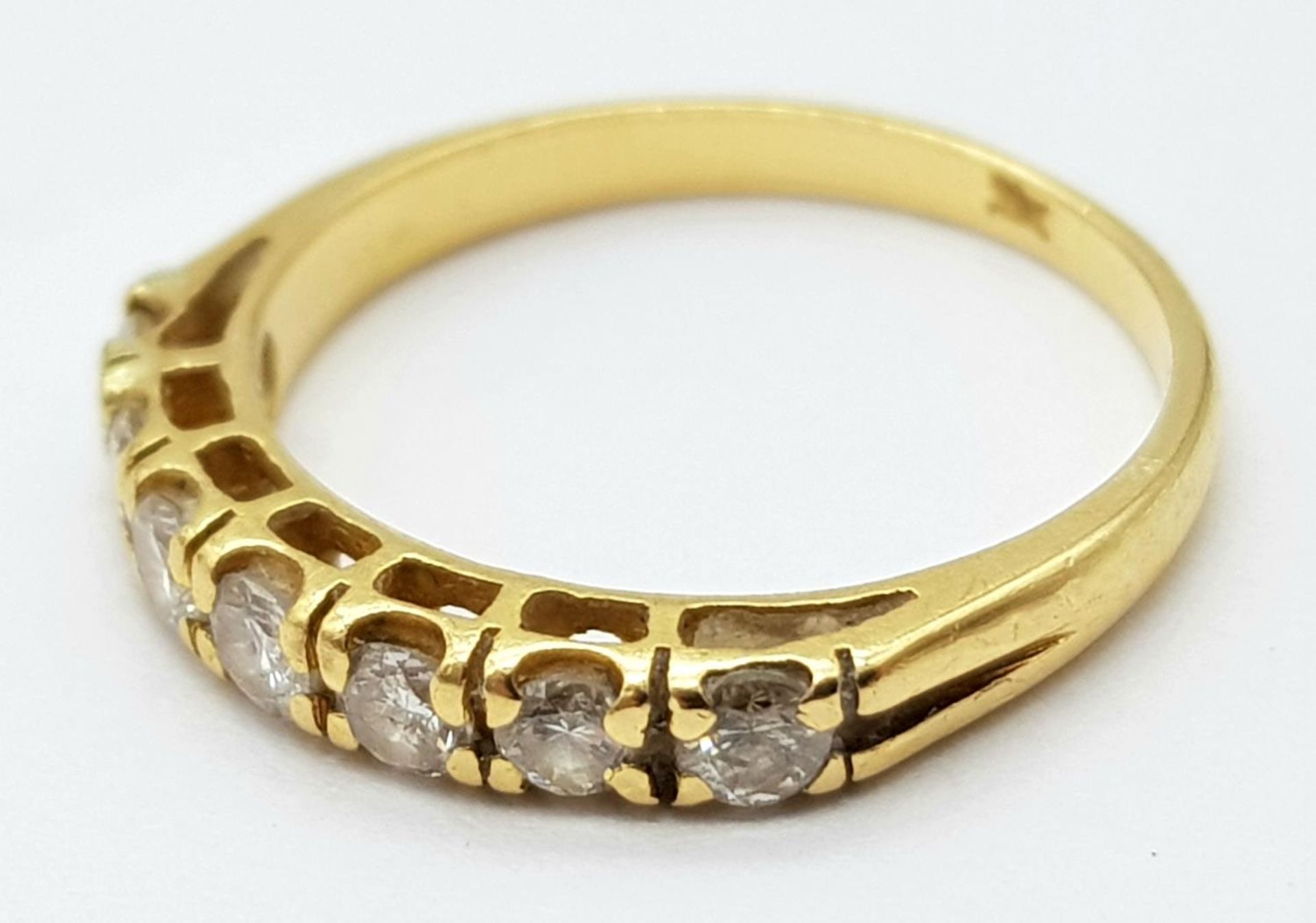 AN 18K (TESTED) YELLOW GOLD DIAMOND BAND RING. 0.35ctw, size I, 1.9g total weight. Ref: SC 9043 - Image 3 of 4