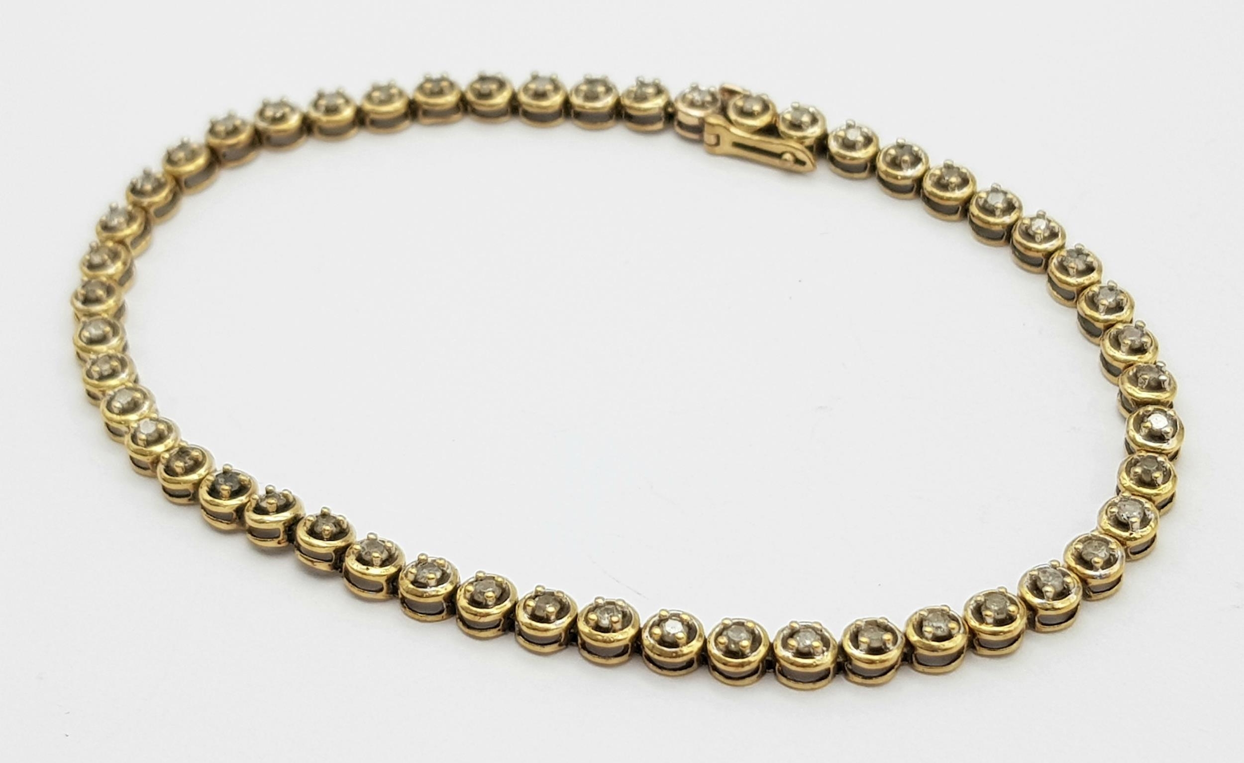 A Vintage 9K Yellow Gold Diamond Tennis Bracelet. 19cm. 5.8g total weight.