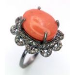 A 6.5ct Coral and Diamond Ring. A coral cabochon with 0.75ctw of Diamond Accents. Size M. Ref: Cd-