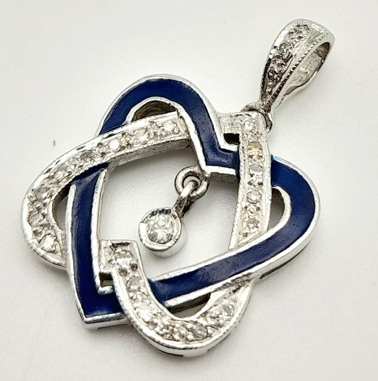 A 9K WHITE GOLD DIAMOND SET DOUBLE ENTWINED HEART PENDANT 2.8G , 24mm x 15mm. SC 9023