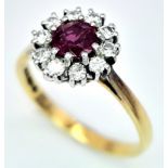 An 18K Yellow Gold, Ruby and Diamond Ring. Round cut ruby with a diamond halo. Size M 1/2. 2.8g