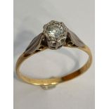 18 carat GOLD and DIAMOND SOLITAIRE RING. Having PLATINUM set DIAMOND mounted to top. 2.4 grams.