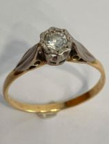 18 carat GOLD and DIAMOND SOLITAIRE RING. Having PLATINUM set DIAMOND mounted to top. 2.4 grams.