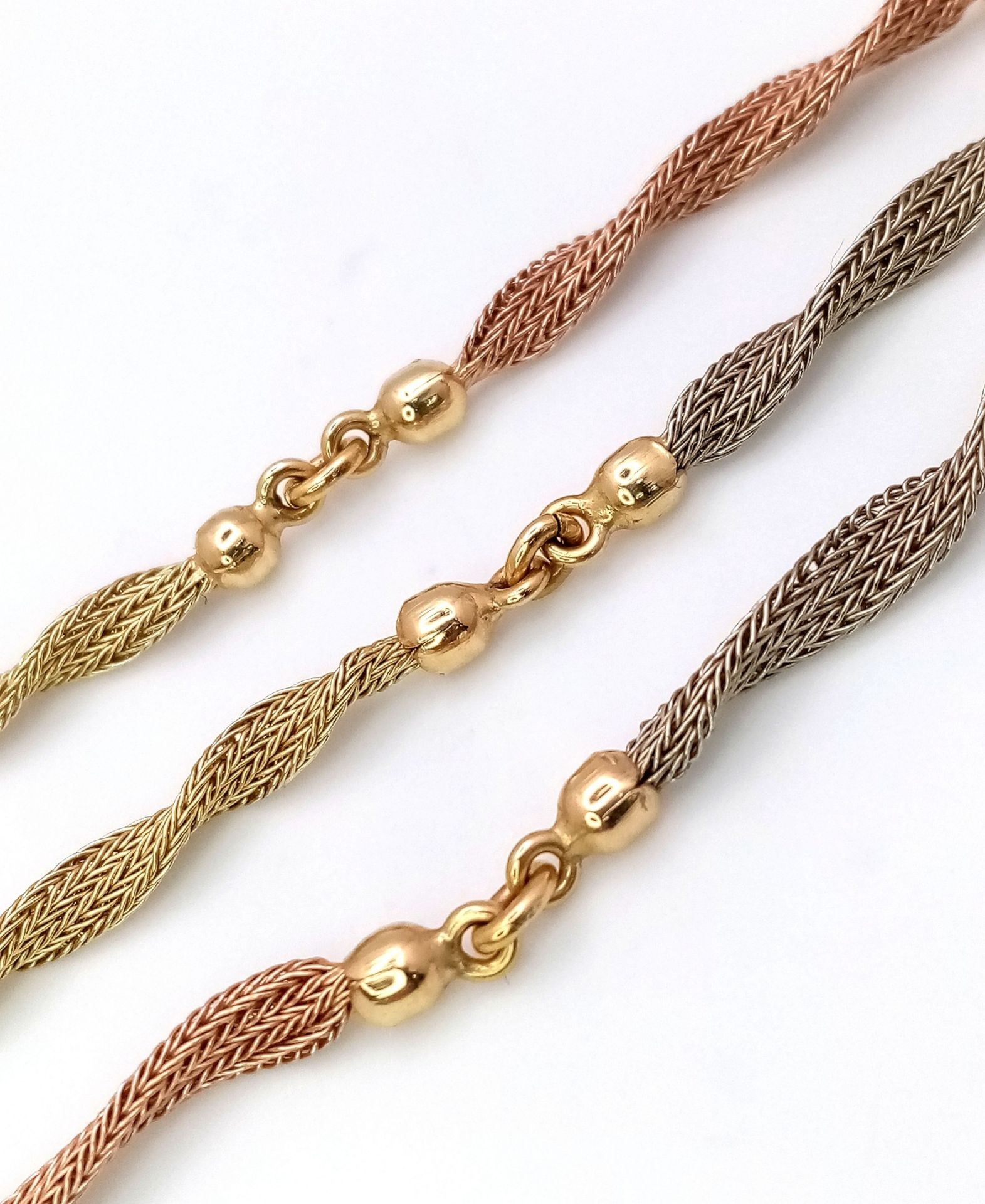 A Beautiful Italian 14K Yellow and Rose Gold Twist Necklace. Ten bars of alternating coloured gold - Image 5 of 6