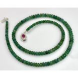 A 90ctw Single Strand Emerald Rondelle Necklace with a Ruby and 925 Silver Clasp. 42cm length.