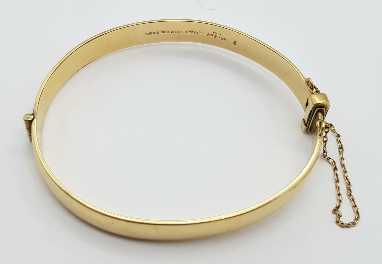 A 9K YELLOW GOLD AND METAL CORE ENGARVED BANGLE 18.3G , 53mm x 60mm diameter. ref: ADAM 9001 - Image 3 of 5