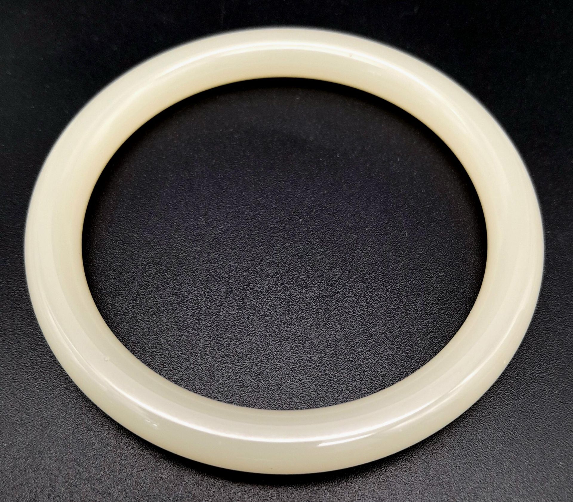 A Light Pastel Shade Thin Jade Bangle. 8mm width. 6cm inner diameter. - Image 3 of 3