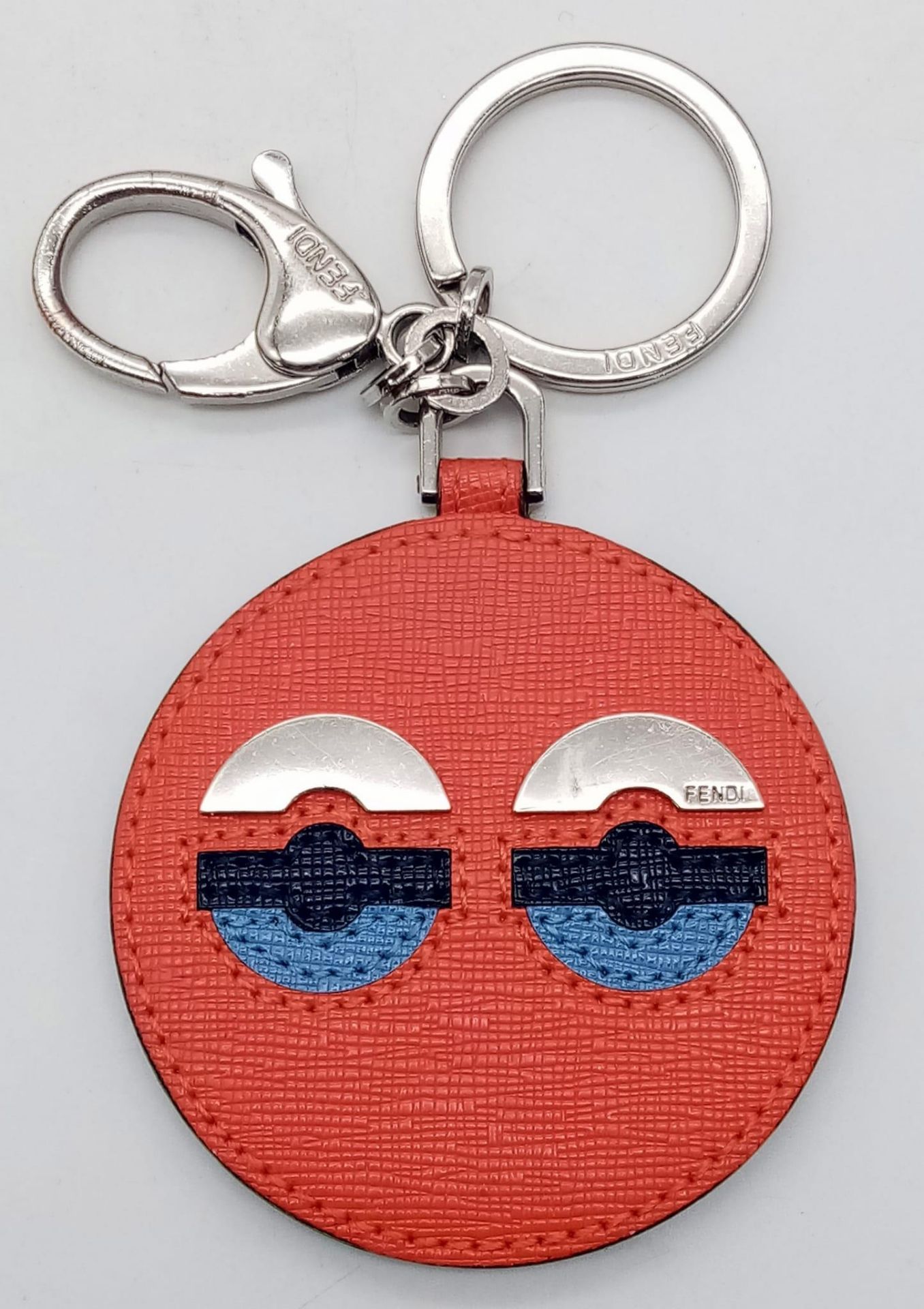 A red leather Fendi monster keychain, silver tone hardware. Diameter6cm. Comes with box. ref:16444